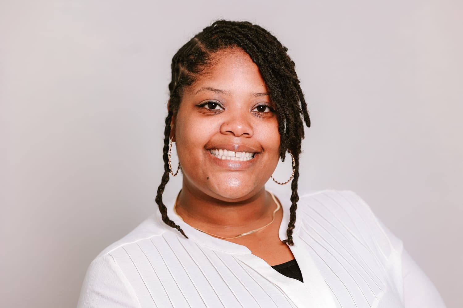 A clean, professional headshot by Photo Phactory